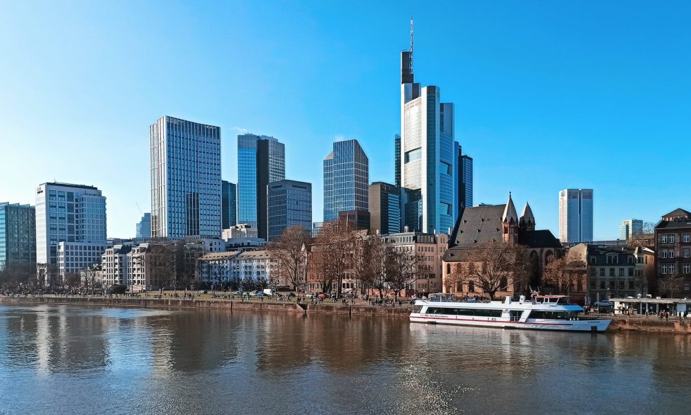 a picturesque view of the city of frankfurt and its riverfront